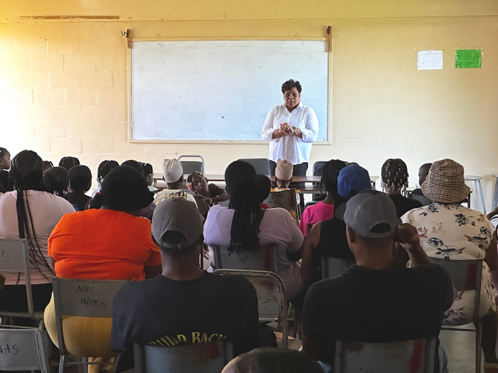 Adults seated and listening during a Bahali emotional wellness workshop.